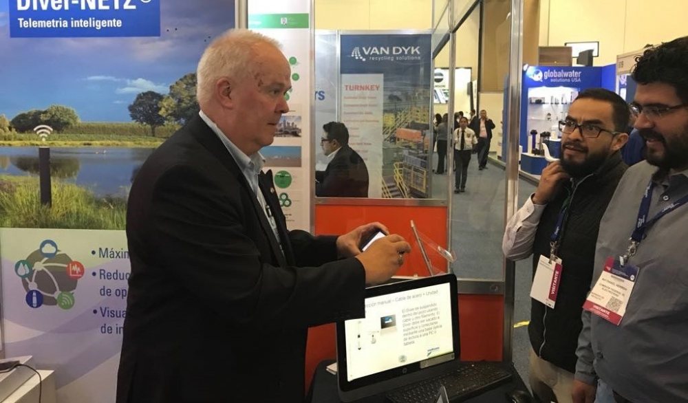 Peter Westerhuis (left) talking to potential clients at the Netherlands Pavilion