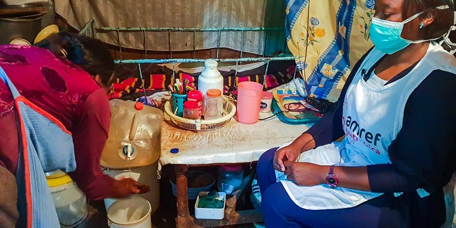 Promena Ndunge, a resident in Kibera, Kenya, shows a handwashing facility at his house.