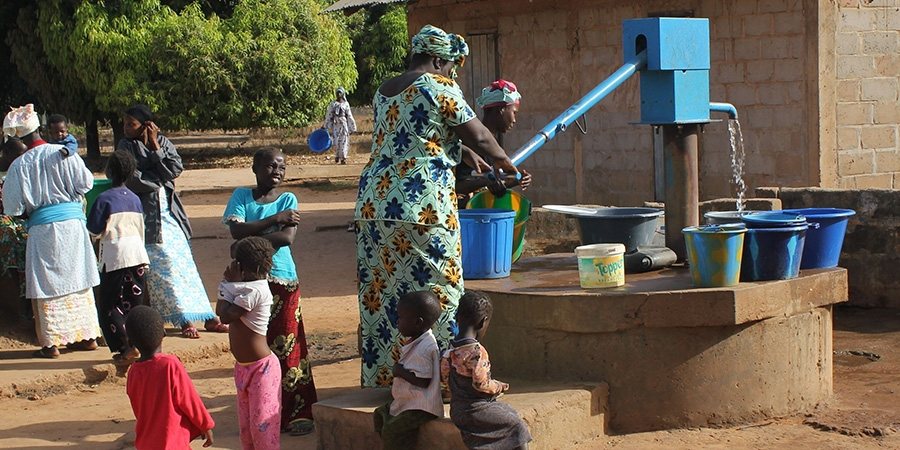 Photo of a water pump installed in a rural area in Africa.