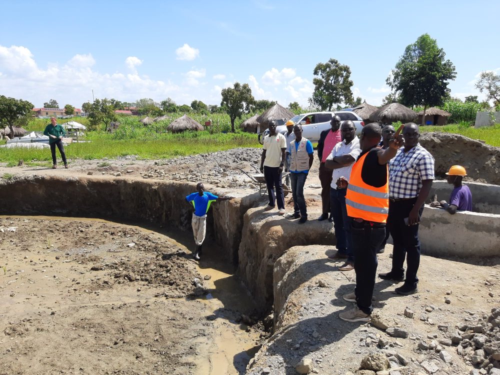 Employees working on the construction of the plant in Imvepi, Uganda