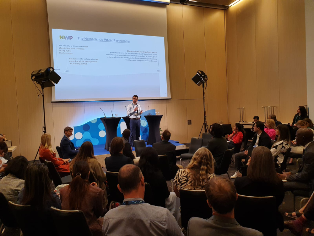 About 50 conference visitors in a conference room listen to the presentation of Rick Elmendorp of NWP at the NoWNET meeting at Stockholm World Water Week 2024
