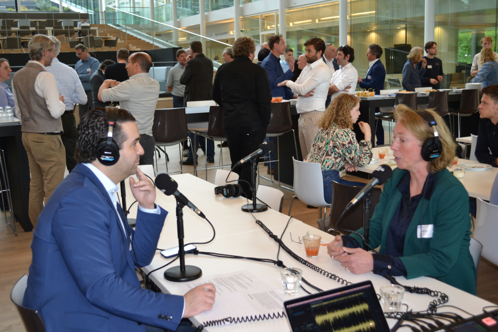 Man and woman talking with microphones 