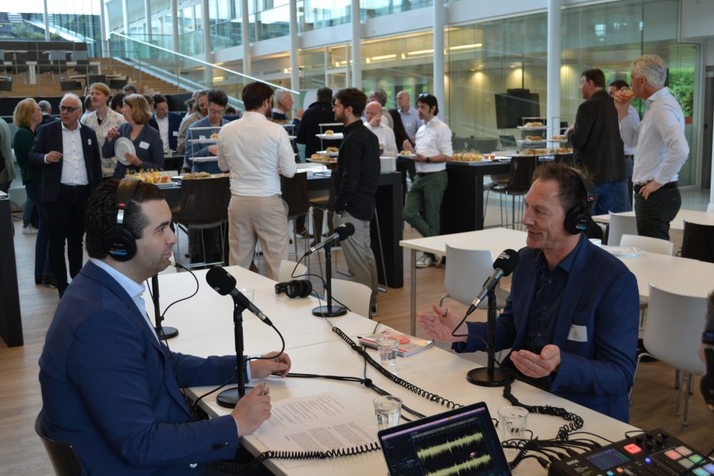 two men talking in microphones