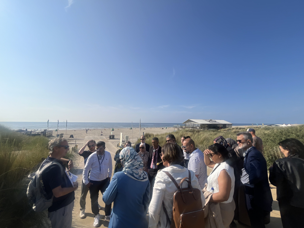 The delegation from Tunisia listens, during a field visit to the Dutch dunes, to an explanation about coastal resilience