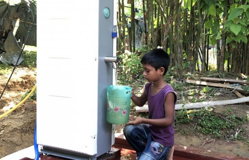 Blog-Villagepump-boy. With the push of a button, villagers can tap at least 500 litres per hour of clean water. People are instructed to use the water for drinking purposes only.