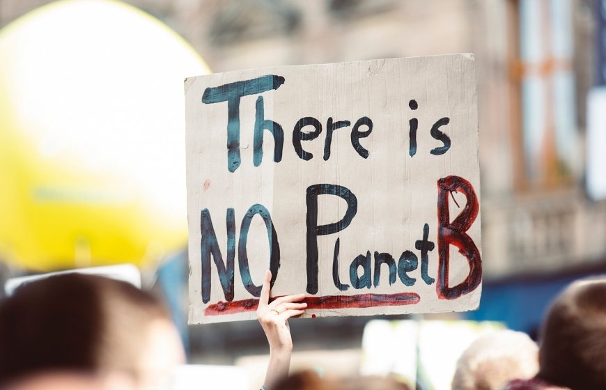 Photo of a placard with the text 'There is no planet B'.