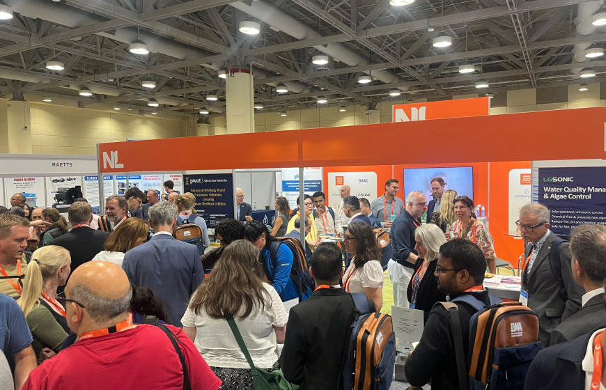 Many congress attendees gather at the orange coloured Netherlands Lounge on the exhibition floor of the congress in Toronto, Canada