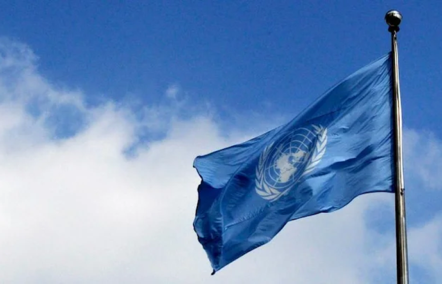 Waving blue flag of the United Nations to a background of blue sky