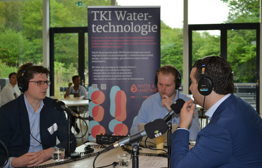 two men talking in microphones