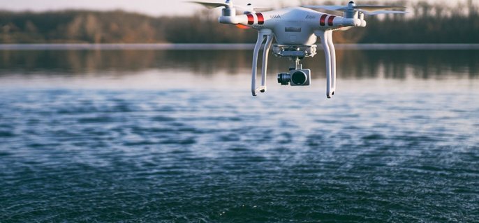 Photo of a drone recording information about water.