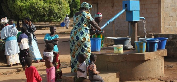 Photo of a water pump installed in a rural area in Africa.
