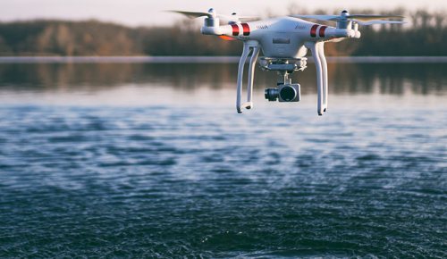 Photo of a drone recording information about water.