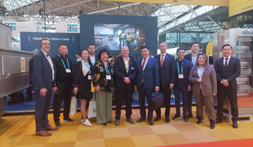 Group of people from Kazakhstan visiting the Nijhuis stand at Aquatech Amsterdam 2025 trade fair