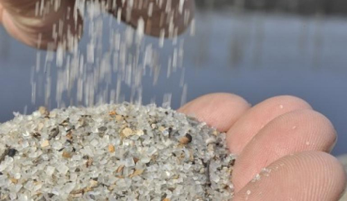 hand holding grains of struviet